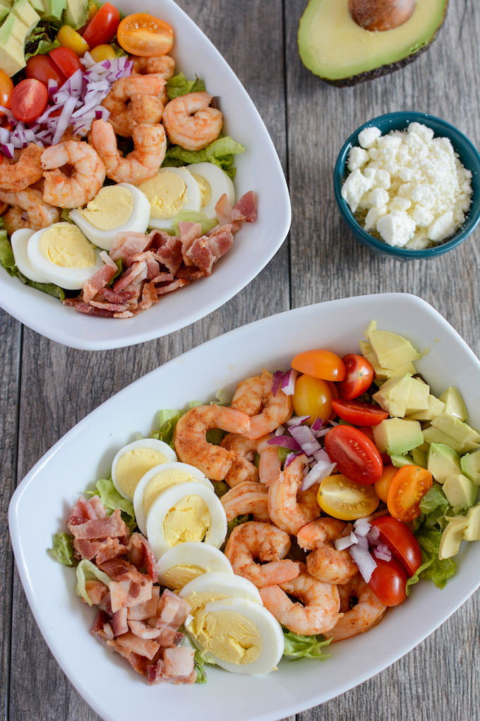 shrimp cobb salad with bacon, avocado, egg, tomato and onion