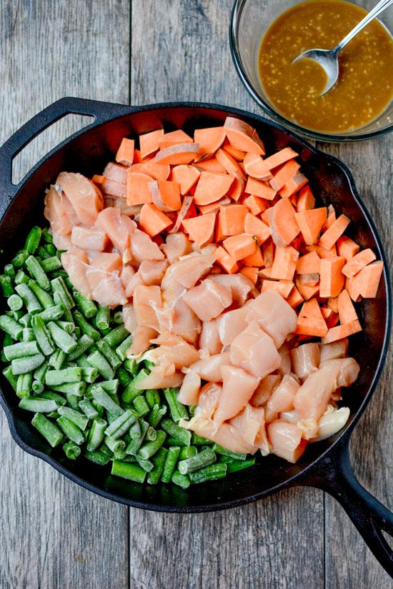 Made with just seven ingredients, this recipe for Maple Mustard Chicken Skillet makes a great weeknight dinner. It's a paleo, gluten-free and full of flavor!