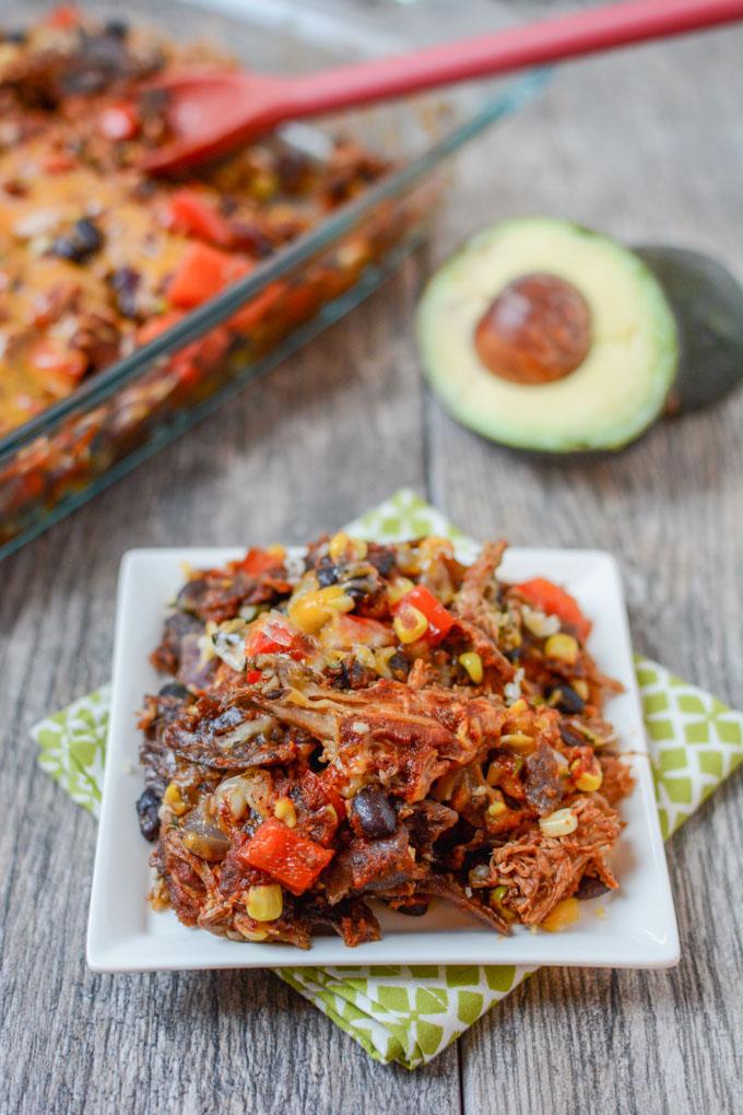 This recipe for Salsa Verde Pork Enchilada Casserole is gluten-free and easily makes two dinners. Serve the slow cooker salsa verde pork with rice one night and turn the leftovers into enchilada casserole later in the week. 