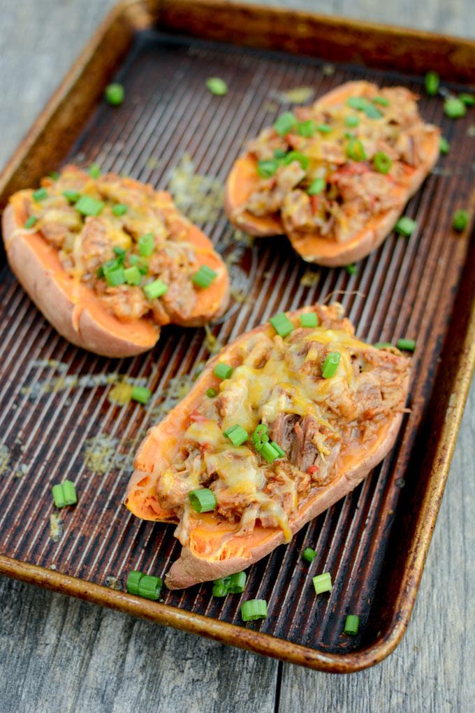 These BBQ Pulled Pork Stuffed Sweet Potatoes are perfect for food prep. Make a big batch of pulled pork and sweet potatoes, stuff them ahead of time and reheat to eat for lunch or dinner.