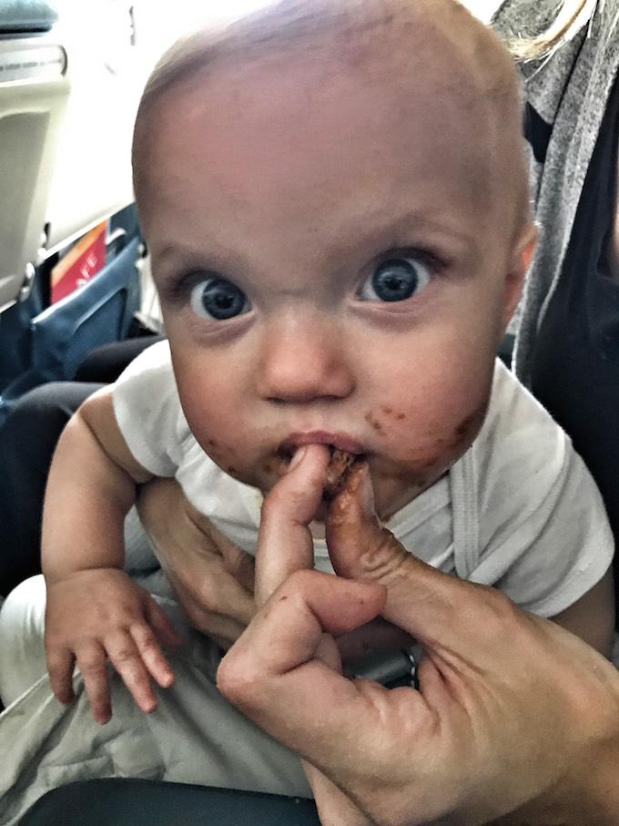 Tips For Flying With Young Kids 7 Kid With Candy On An Airplane