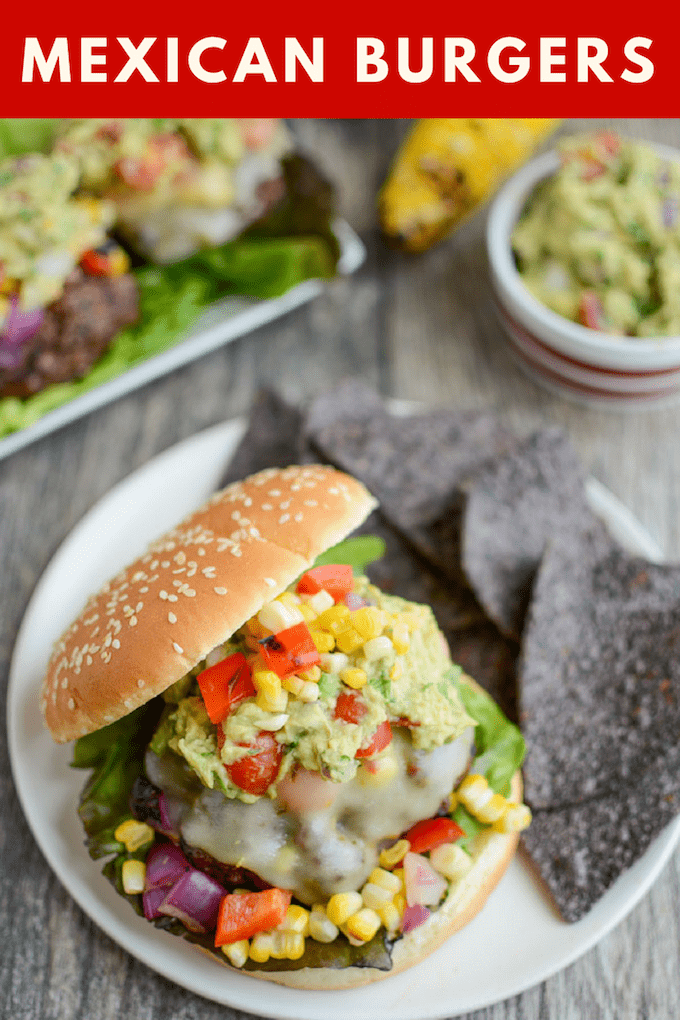 These Mexican Burgers are perfect for your summer cookout or party. Topped with grilled corn salsa, pepperjack&nbsp;cheese and lots of guacamole, each bite is packed with flavor!