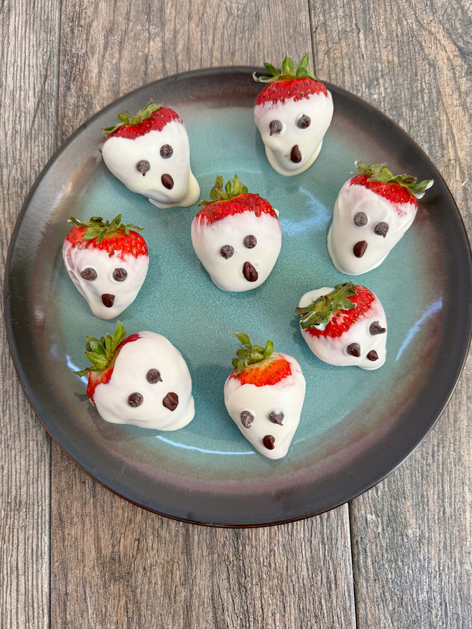 Halloween Snacks with Fruit - white chocolate dipped strawberries on a plate